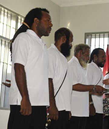 Indonesian President Joko Widodo (right)  hands over the official pardon to five Papuan political prisoners at a prison in Jayapura on May 9.  Photo: Antara Foto