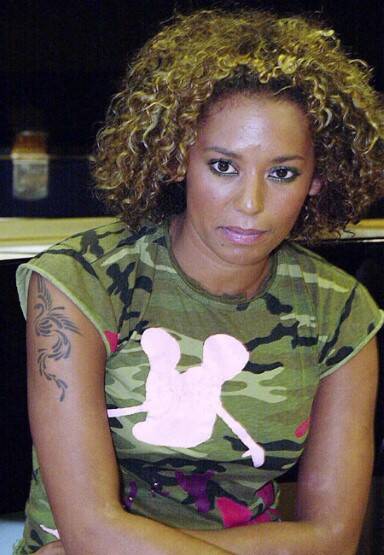 Another former spice girl, Mel B, looks sceptical about her stencil-like phoenix tattoo, and so she should. Photo: inlightpress.com