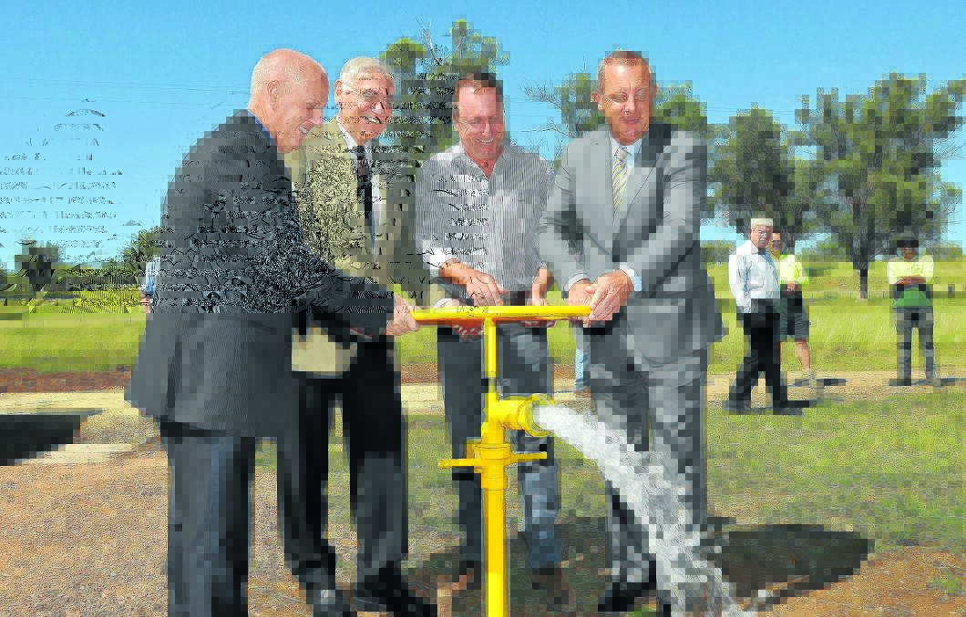 DROUGHT-PROOFED: Liverpool Plains mayor Andrew Hope, Upper Hunter MP George Souris, Barwon MP Kevin Humphries and Upper Hunter mayor Michael Johnsen turn the wheel to commence pumping of Wallabadah’s new bore. Photo: Geoff O’Neill 290115GDA02