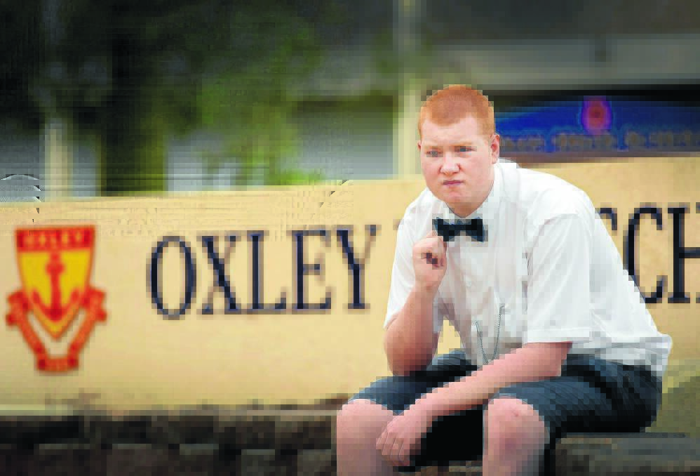 HANDS TIED: Oxley High Year 12 student Dylan Sollars with the trademark bow tie that could have him suspended from school. Photo: Gareth Gardner 200215GGC02