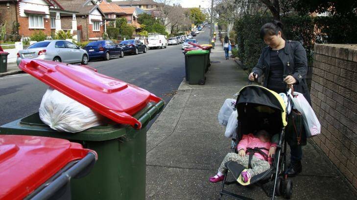 Tracy Lin, an Ashfield resident, was surprised to find her rubbish had still not been collected Photo: Louise Kennerley 
