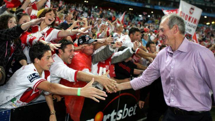 The drought is over: Wayne Bennett celebrates with St George Illawarra fans after the club's grand final win in 2010. Photo: Andy Zakeli