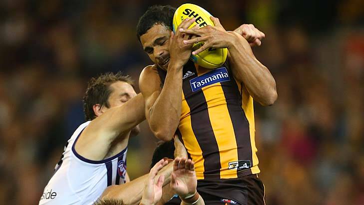 Hawthorns Cyril Rioli marks stronglyin the third quarter. He would play on and goal. Photo: Pat Scala