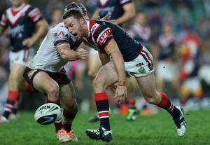 Setback: Roosters five-eighth James Maloney  yells as the ball slips from his hands against Manly. Photo: Anthony Johnson