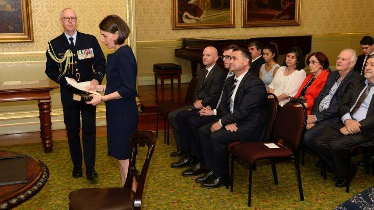 Ms Berejiklian is sworn in by Governor David Hurley at Government House. Photo: Wolter Peeters
