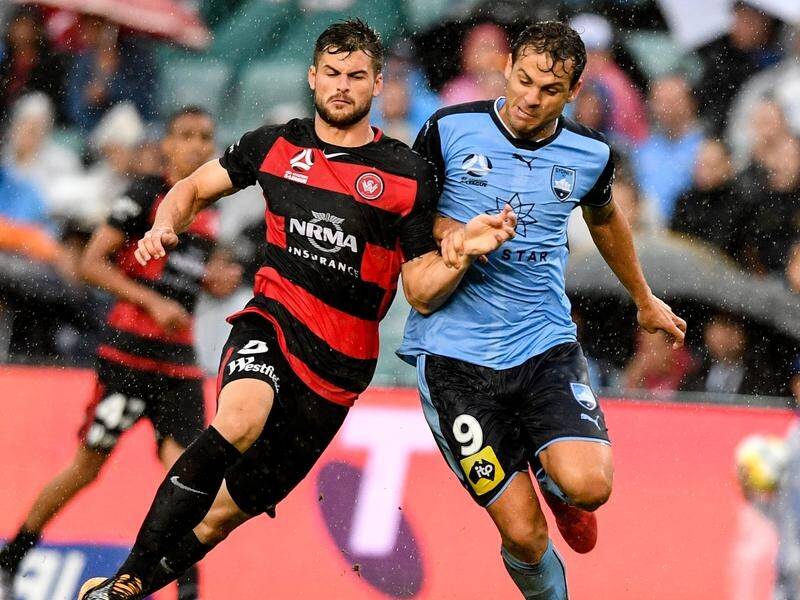 Defender Brendan Hamill (left) wants the Wanderers to step it up over the final six rounds.