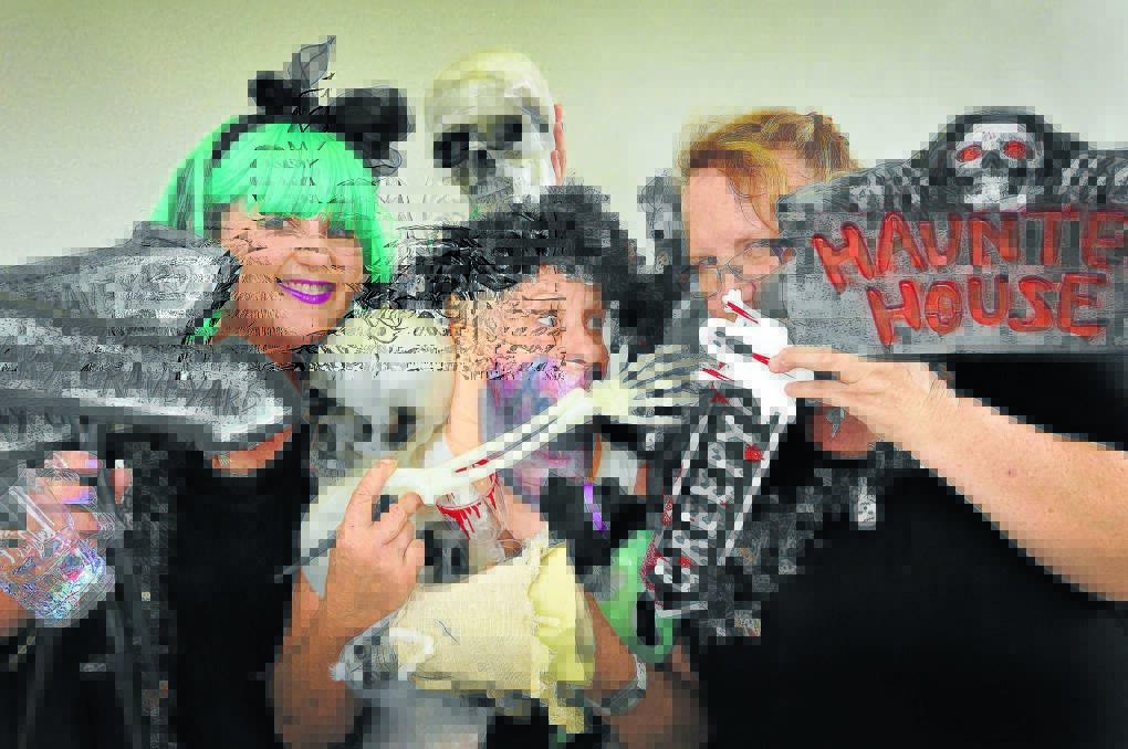 THOSE GHOULS: Carolyne Morris, Kerry Walsh and Wendy Wood are ready to get ghastly to welcome in 2015 at the Tamworth Services Club. Photo: Geoff O Neill 161214GOC01