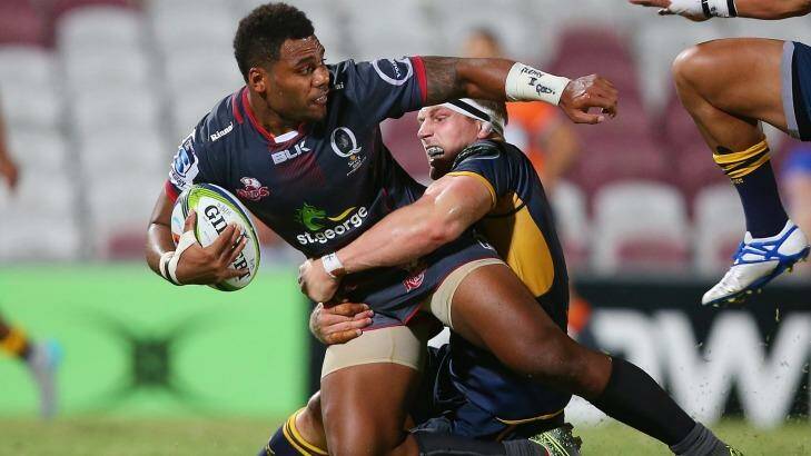 David Pocock of the Brumbies puts the brakes on Samu Kerevi of the Reds. Photo: Chris Hyde