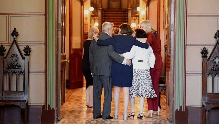 Ms Berejiklian embaces her parents and sisters at Government House. Photo: Wolter Peeters