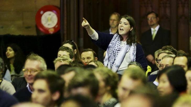 Widespread opposition ... a student protests against fee deregulation at the meeting on Monday night. Photo: Wolter Peeters