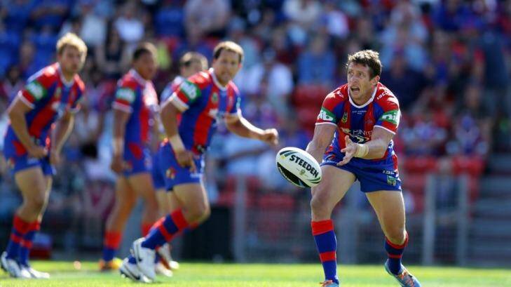 Playing for Alex: Knights captain Kurt Gidley gets a pass away against the Sharks. Photo: Jonathan Carroll