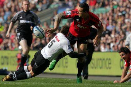 Overseas experience: Sonny Bill Williams offloads during the Crusaders' 'home' game against the Sharks in London in 2011.  Photo: Iain McGregor