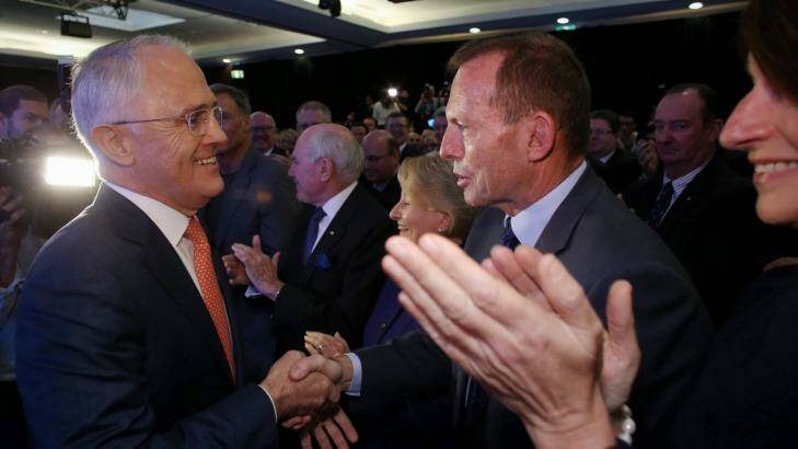 Mr Turnbull greets Mr Abbott before the launch. Photo: Andrew Meares