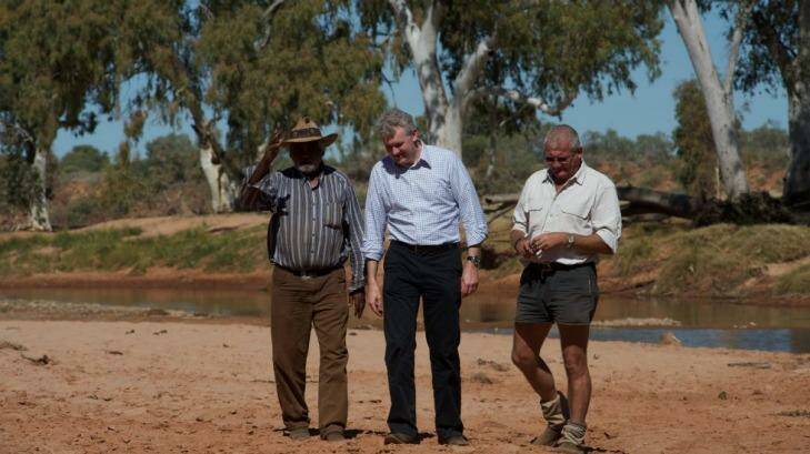 Bruce Breaden, traditional owner, the then environment minister Tony Burke and RM Williams Agricultural Holdings managing director David Pearse at Henbury in 2011. Photo: Parks Australia
