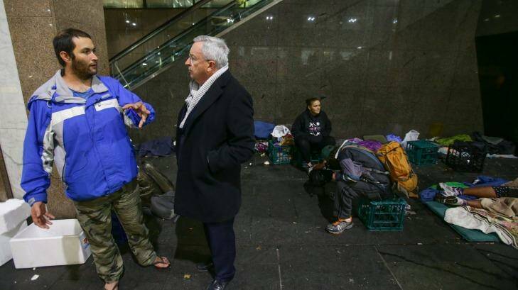 Social housing minister Brad Hazzard, speaks with David, who is homeless and spending his nights in Martin Place while he awaits housing. Photo: Dallas Kilponen