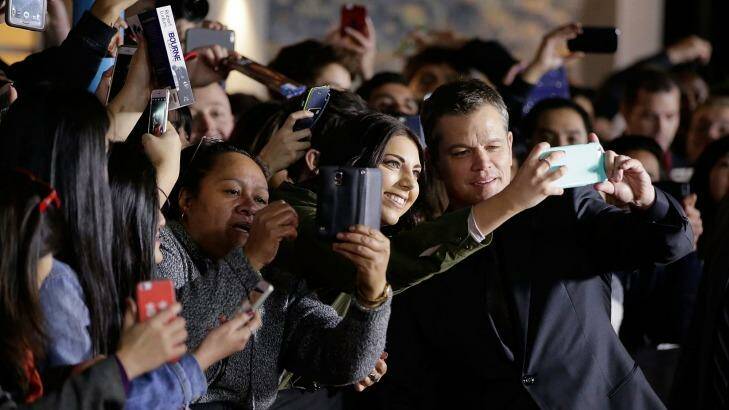 Matt Damon poses for selfies at the premier of <i>Jason Bourne</i> in Sydney. Photo: Mark Metcalfe