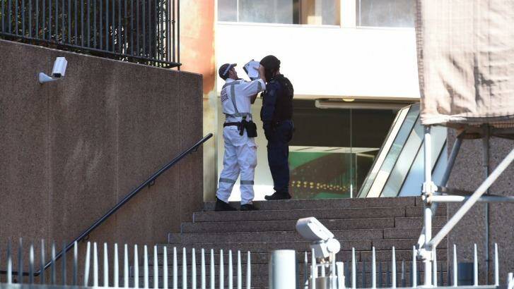 Officers from the bomb squad attend NSW Parliament House after reports of a suspicious package found near the building. Photo: Nick Moir
