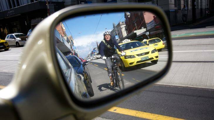 The overlap zone: cyclists often need to merge into faster-moving traffic to pass parked cars. Photo: Steve Lightfoot