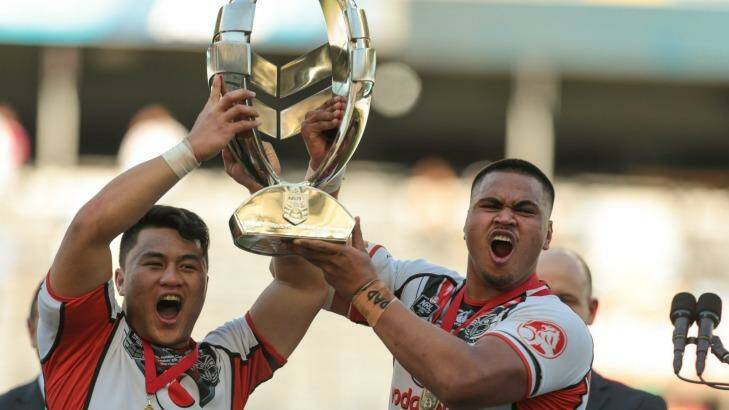 Narrow win: Mason Lino (left) and Sam Lisone celebrate the Warriors' victory over the Broncos. Photo: Christopher Chan