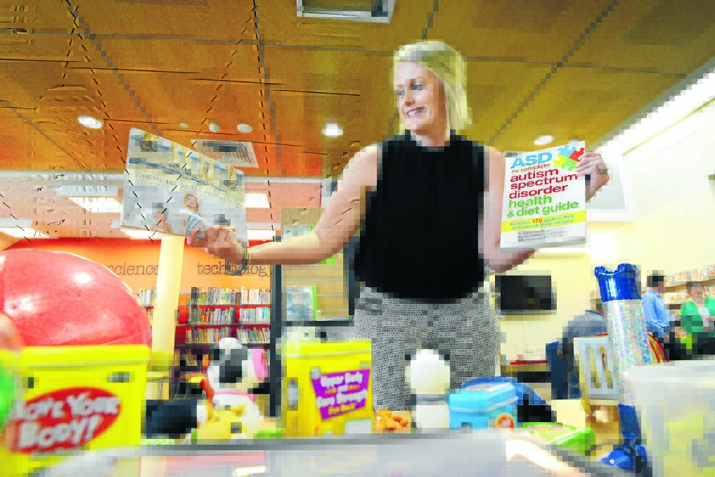SUPPORT MATERIAL: Youth and outreach services librarian Katey Allwell launched the Central Northern Regional Library’s Autism Spectrum Disorder collection in Tamworth yesterday. Photo: Barry Smith 041115BSB02
