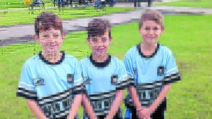 Timbumburi s Joseph Briggs, Hayden Constable and Rory Littlejohns played hockey for the North West team in a state carnival in Wollongong.