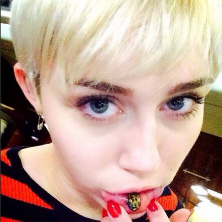 Luckily, this tattoo of a sad cat on the inside of Miley Cyrus' lip is a face. The rest of these tattoos, however, are not... Photo: Miley Cyrus/Instagram