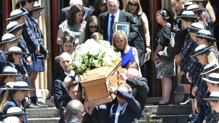 Georgina Bartter's family walk behind her casket at St Mary's, North Sydney. Photo: Nick Moir