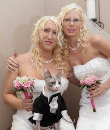 Purrfect pair: Jennifer Hendrix, Erica Nagel and Zeno suitably attired for their Vegas wedding.
