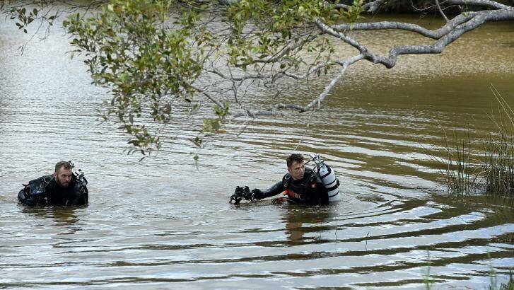Police divers search the river where Tiahleigh Palmer's body was found. Photo: Bradley Kanaris