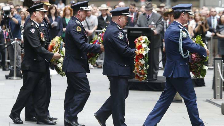 Representatives of branches of Australia's emergency services paid tribute to war veterans at the service at the cenotaph. Photo: Jason Reed/Reuters