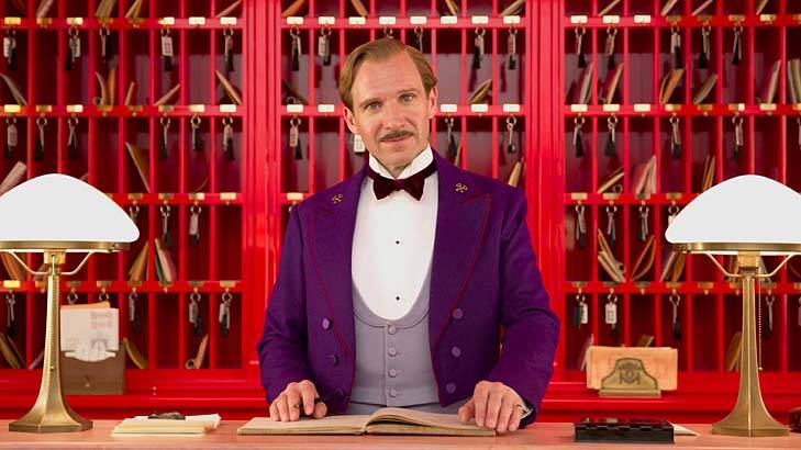Hello, darlings: Ralph Fiennes as the suave Gustave H. in <i>The Grand Budapest Hotel</i>.