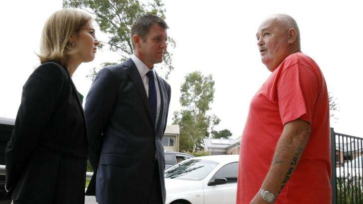 NSW Premier Mike Baird and Family and Community Services Minister Gabrielle Upton talk to  Rosemeadow resident Tom Puffett about  public housing issues on Monday. Photo: Anna Warr