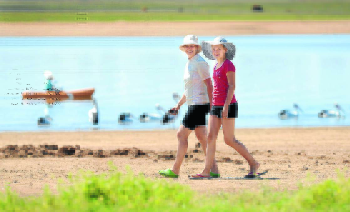 WEEKEND WONDERLAND: Sharon Lewis from Canberra and her niece Alissa Mogg, 13, of Brisbane, walk the shore of Lake Keepit yesterday. 031014BSA18