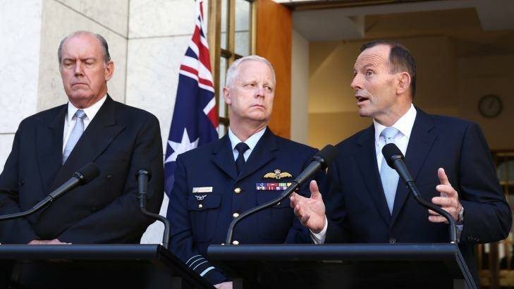 Prime Minister Tony Abbott announced Australia's involvement in air strikes, flanked by Defence Minister David Johnston and Chief of the Defence Force, Air Chief Marshal Mark Binksin, last Friday. Photo: Alex Ellinghausen
