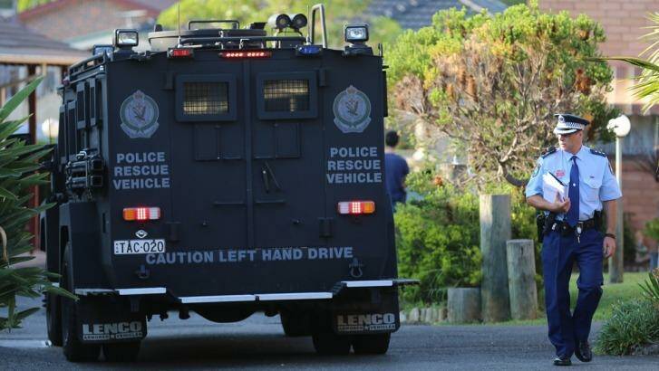 Police from the Joint Counter Terrorism Team conduct raids across south-western Sydney last December.  Photo: NSW Police