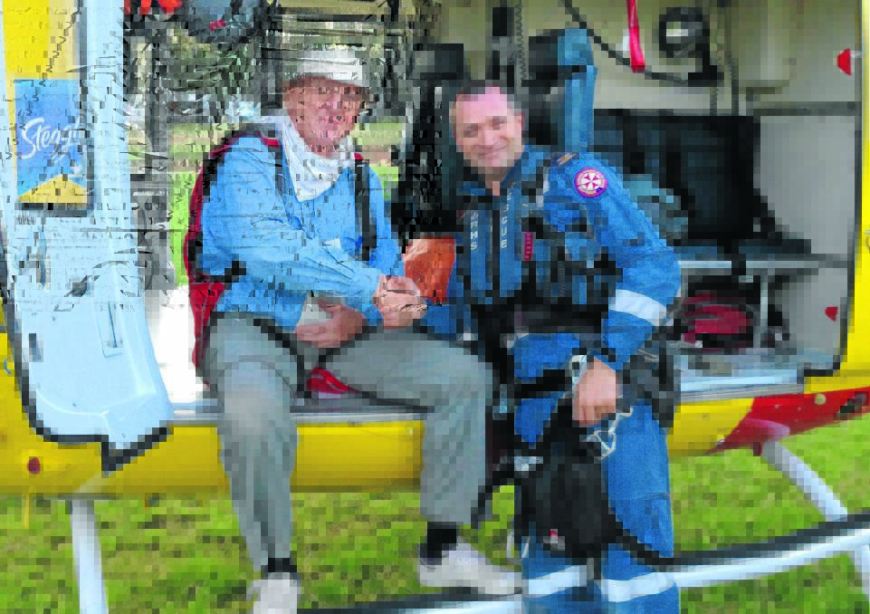 RESCUED: Glider Paul Mander, pictured with paramedic Scott Hardes, waited for more than two hours to be rescued by the Newcastle Rescue Chopper, after he landed his glider in scrub south of Narrabri.