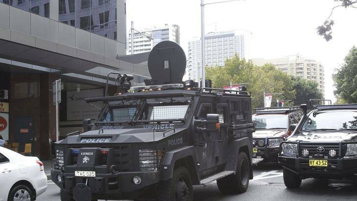 A NSW police tactical vechile drives past the Downing Centre courts on
Liverpool street this morning. Photo: Kate Geraghty