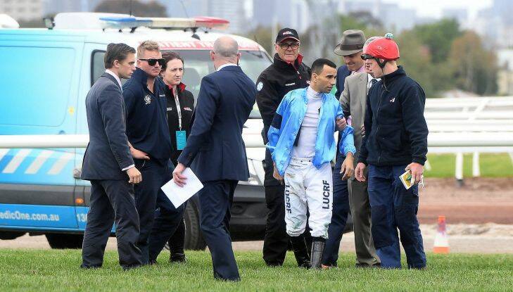 Jockey Joao Moreira is seen after a fall on horse Royal Monarch during race 4 of Melbourne Cup Day at Flemington Racecourse in Melbourne, Tuesday, November 7, 2017. (AAP Image/Julian Smith) NO ARCHIVING
