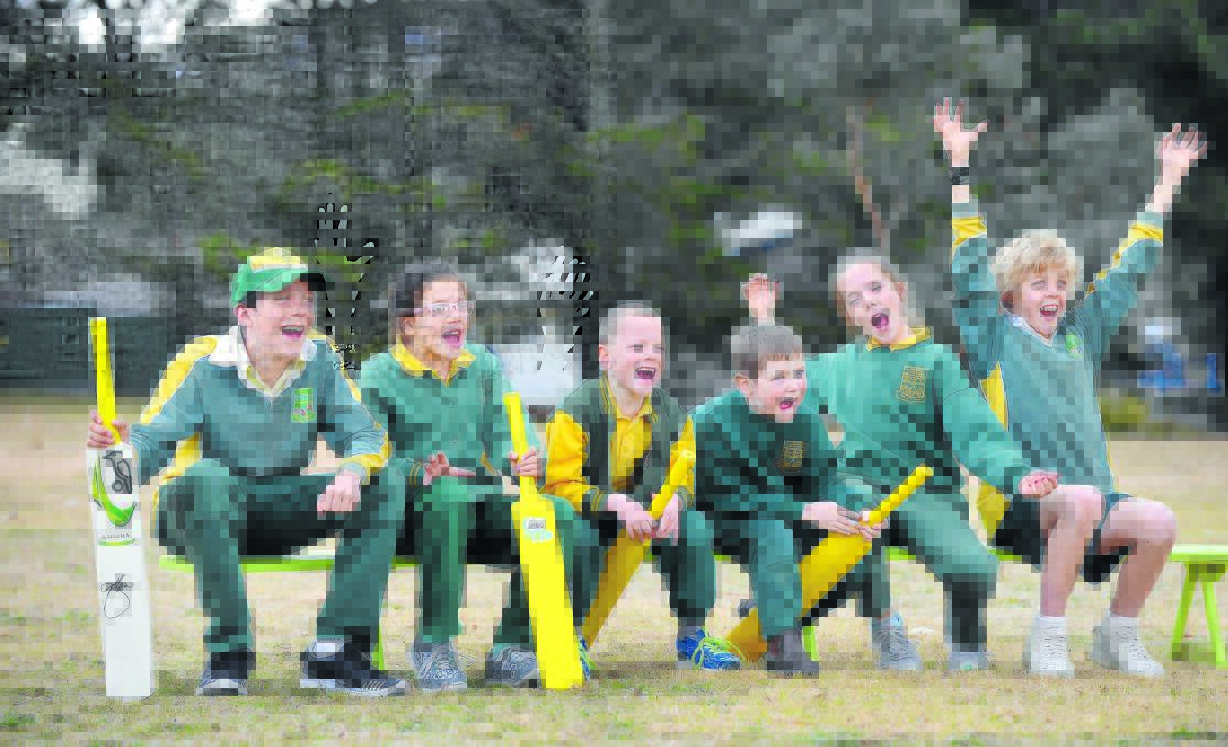 PHOTO  BENDY BACKERS: Bendemeer Public School Josh Hazlewood fans, from left Lachlan Chaffey, Ruby Chaffey, Jayden Donnelly, Lawson?Miller, Lily Chaffey and Seth Axon on the bench. Photo: Barry Smith 220715BSA13