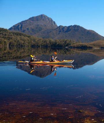 Paddling through Forest Lagoon at the edge of Bathurst Harbour, with Mount Rugby behind. Photo: Andrew Bain