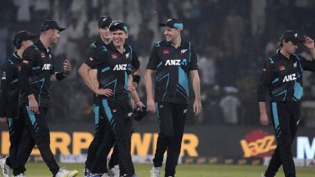 New Zealand celebrate their four-run win over Pakistan in their T20 international in Lahore. (AP PHOTO)