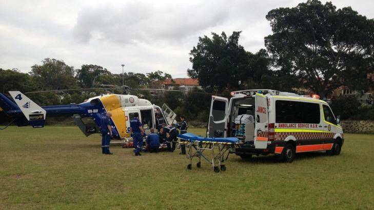 A CareFlight doctor and paramedics treat the boy before flying him to Westmead Children's Hospital. Photo: CareFlight
