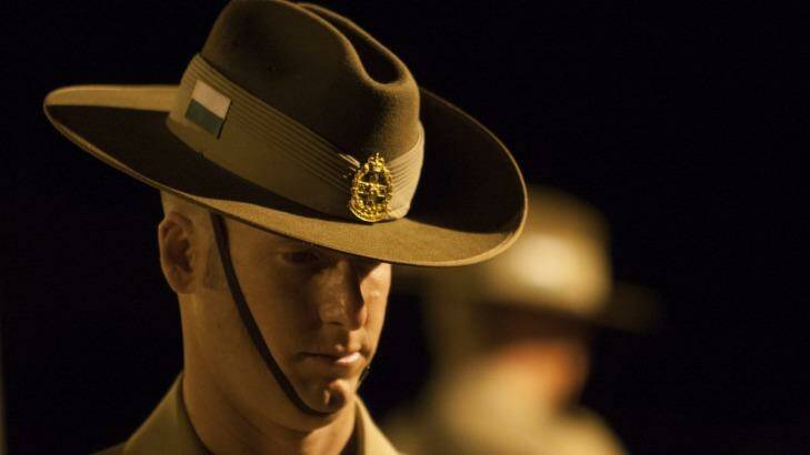 A soldier takes part in a remembrance service. Photo: Christopher Chan