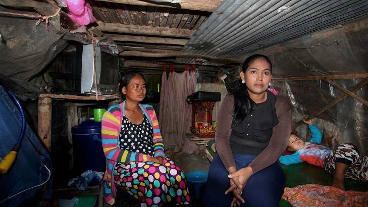 Inside Hour Vanny's cramped shanty home with her sister-in-law Som Tha Satry, 33, who gave birth to twins in October. Photo: Craig Skehan