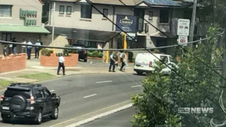 Police arrest a man alleged to have carried out the stabbing. Photo: Nine News