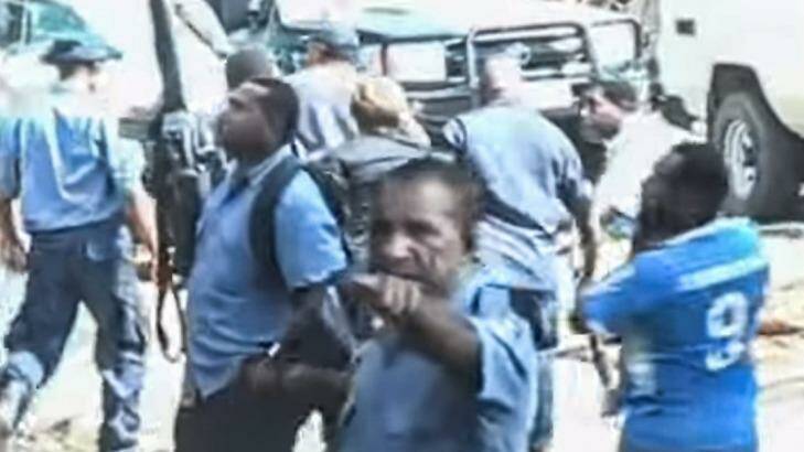 Papua New Guinea police leading Dame Carol Kidu away. Photo: The Opposition