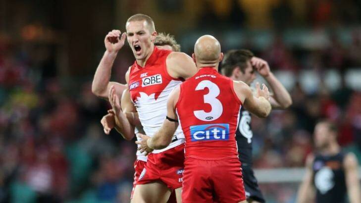 Whooping it up: Sam Reid enjoys booting a major against the Blues. Photo: Anthony Johnson