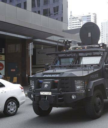 A NSW police tactical vechile drives past the Downing Centre courts on
Liverpool street this morning. Photo: Kate Geraghty