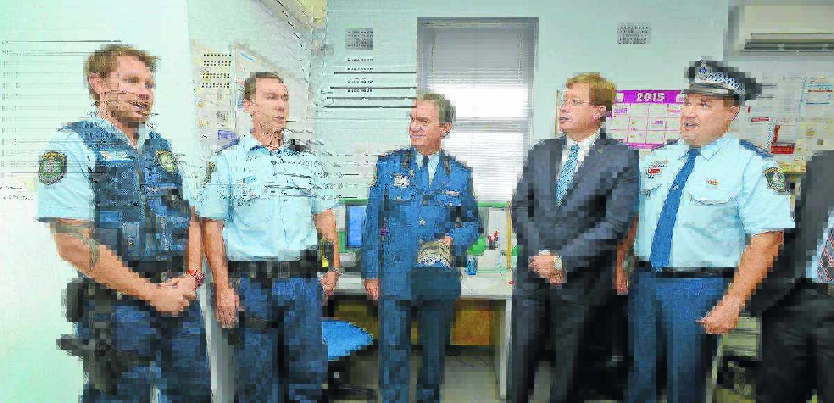 ON TOUR: From left, Constable Brian McDougall and Constable Stephen Garrett show Police Commissioner Andrew Scipione and Acting Premier Troy Grant around the Gunnedah Police Station with Oxley Acting Superintendent Paul Johnson.  Photo: Barry Smith 200515BSB20