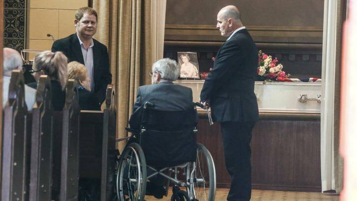 Suzanne King's brother, Robert Cooper, sits in a wheelchair at the funeral in North Ryde. Photo: Peter Rae